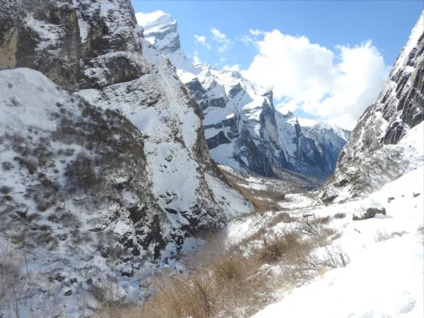 snow covered on the rocky mountain cliffs, Annapurna trekking in Nepal in December