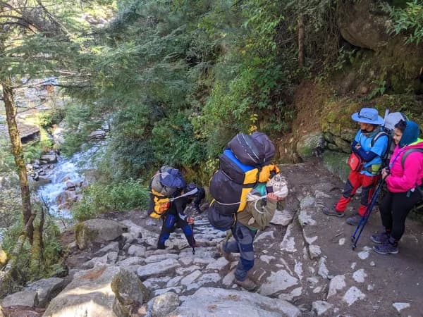Porter On Trekking Trail From Phakding To Namche Bazaar